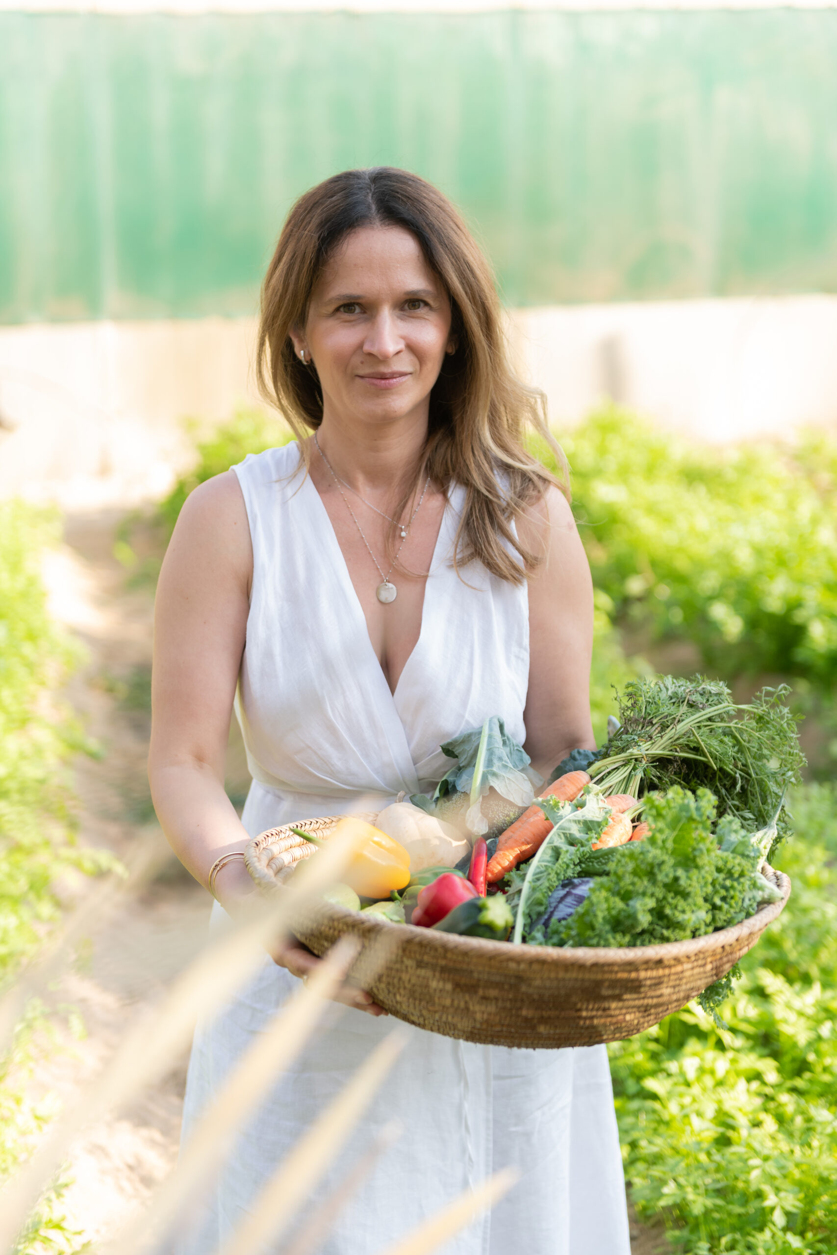 Carrying a basket of vegetables